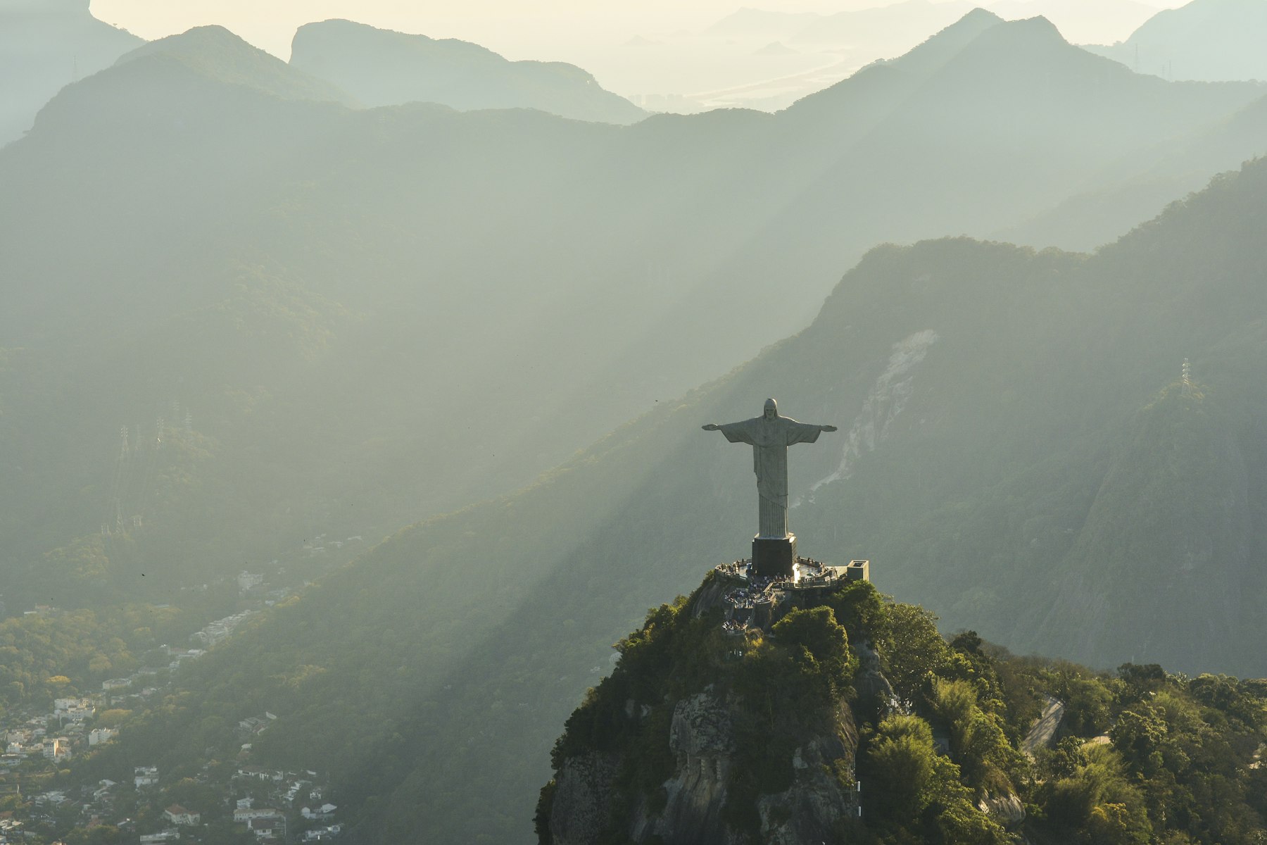 Christ the Redeemer above Rio de Janeiro in golden morning haze